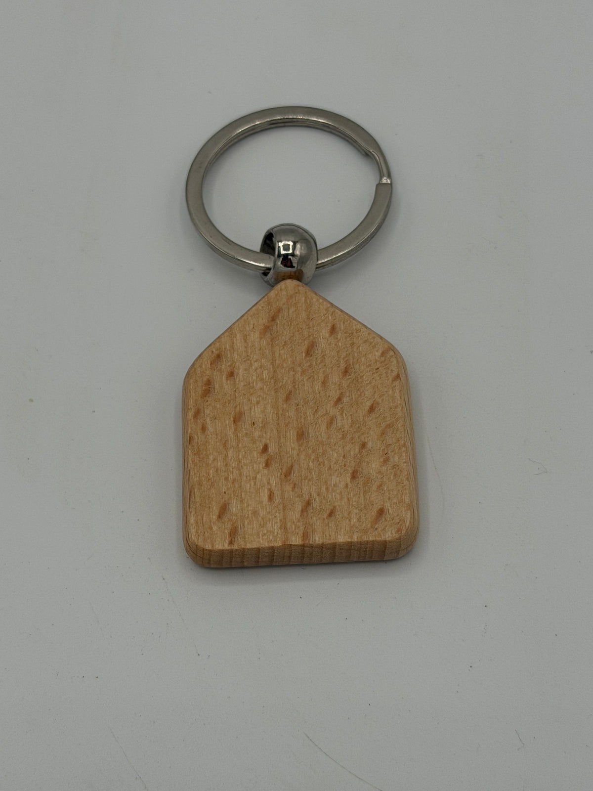 Black and brown Wooden Hive Studio Key chain